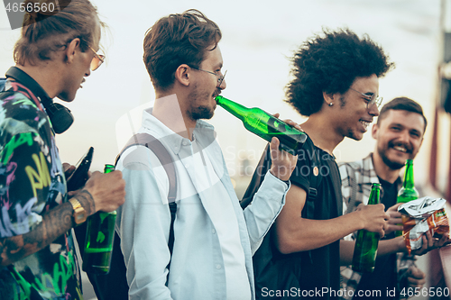 Image of Group of friends celebrating, resting, having fun and party in summer day