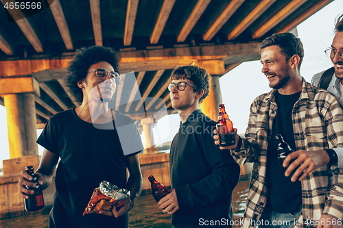 Image of Group of friends celebrating, resting, having fun and party in summer day