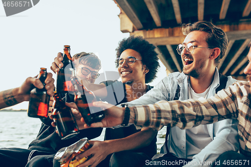 Image of Group of friends celebrating, resting, having fun and party in summer day