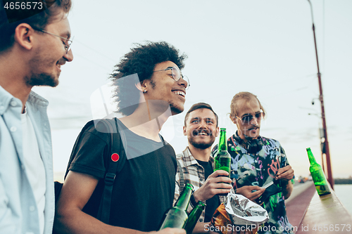 Image of Group of friends celebrating, resting, having fun and party in summer day