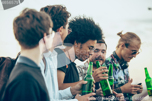 Image of Group of friends celebrating, resting, having fun and party in summer day