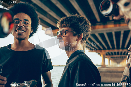 Image of Group of friends celebrating, resting, having fun and party in summer day