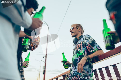 Image of Group of friends celebrating, resting, having fun and party in summer day