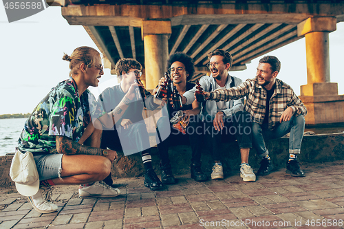 Image of Group of friends celebrating, resting, having fun and party in summer day