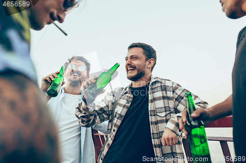 Image of Group of friends celebrating, resting, having fun and party in summer day