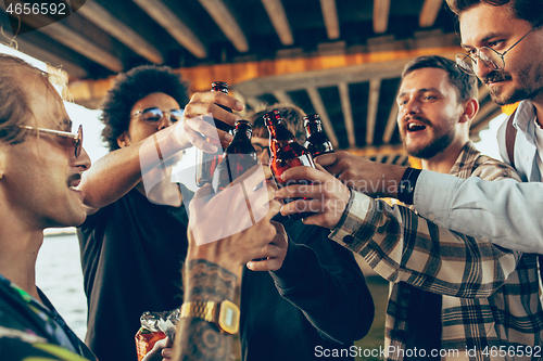 Image of Group of friends celebrating, resting, having fun and party in summer day