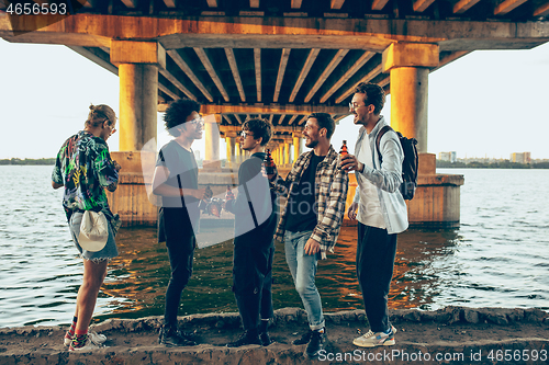 Image of Group of friends celebrating, resting, having fun and party in summer day