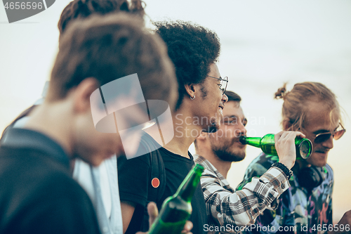 Image of Group of friends celebrating, resting, having fun and party in summer day