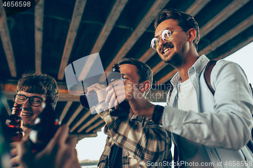 Image of Group of friends celebrating, resting, having fun and party in summer day