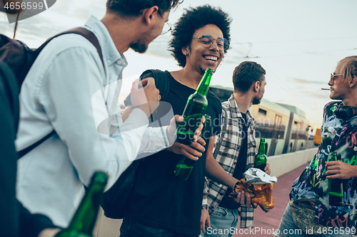 Image of Group of friends celebrating, resting, having fun and party in summer day