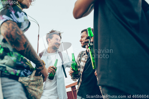 Image of Group of friends celebrating, resting, having fun and party in summer day
