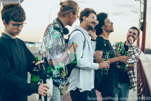 Image of Group of friends celebrating, resting, having fun and party in summer day