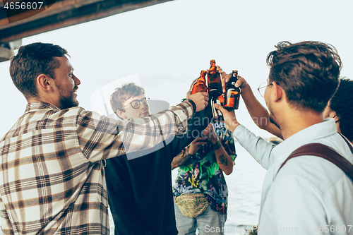 Image of Group of friends celebrating, resting, having fun and party in summer day