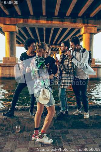 Image of Group of friends celebrating, resting, having fun and party in summer day