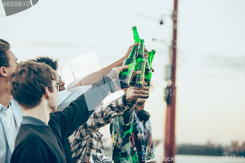 Image of Group of friends celebrating, resting, having fun and party in summer day