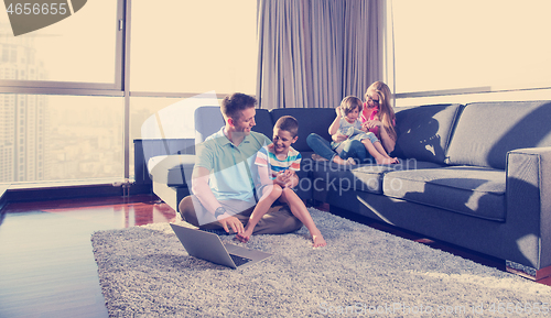 Image of Happy family playing a video game