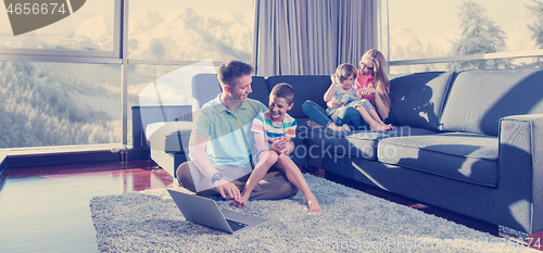 Image of Happy family playing a video game