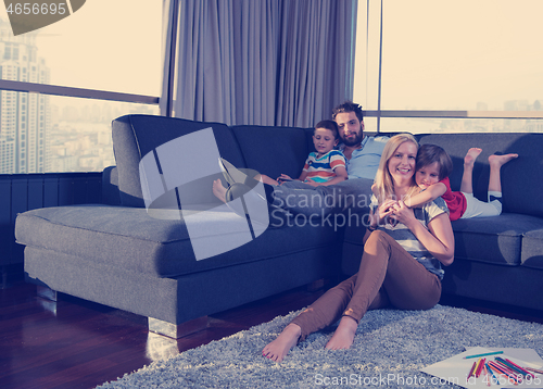 Image of young couple spending time with kids