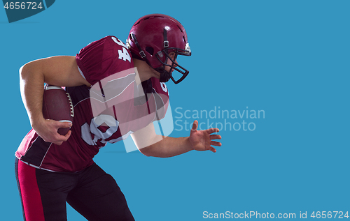 Image of American football Player running with the ball