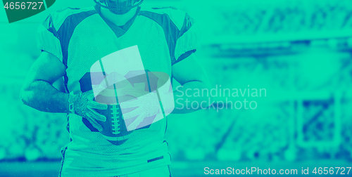 Image of closeup American Football Player isolated on big modern stadium