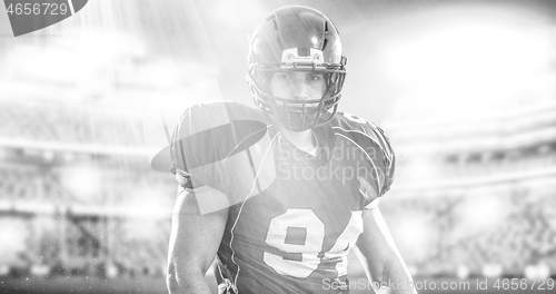 Image of American Football Player isolated on big modern stadium field