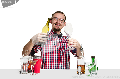 Image of Expert barman is making cocktail at studio