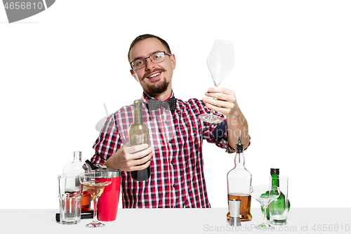 Image of Expert barman is making cocktail at studio