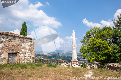 Image of typical Saint Mary Statue on a hill in Italy Marche