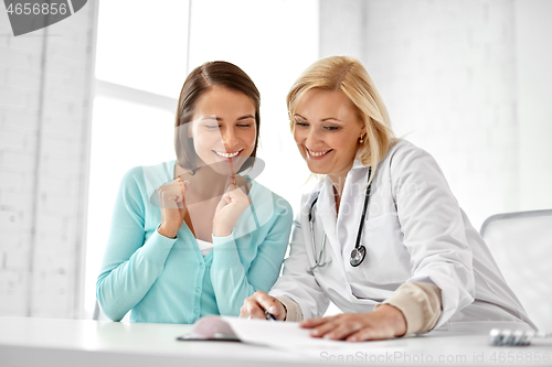 Image of doctor happy woman patient at hospital