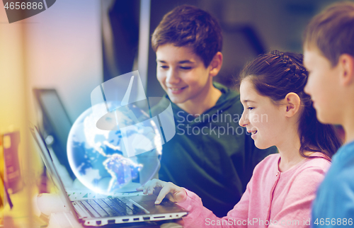 Image of children with laptop and earth planet hologram