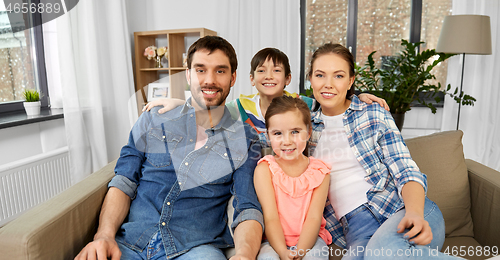 Image of portrait of happy family at home