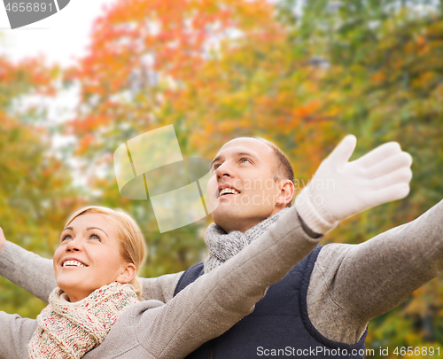 Image of smiling couple in autumn park