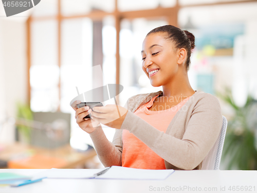 Image of african american woman with smartphone