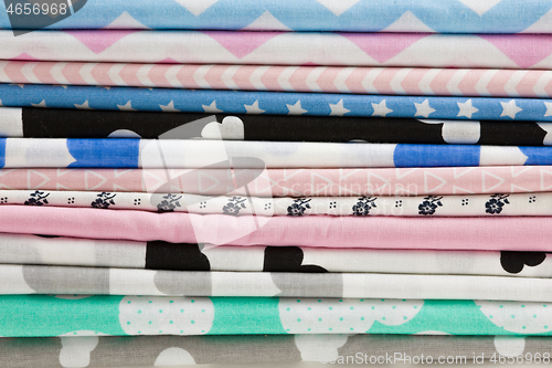 Image of Stack of cotton fabric material background