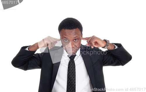 Image of Man with his fingers in his ear