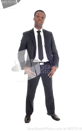 Image of African man standing in suit and tie