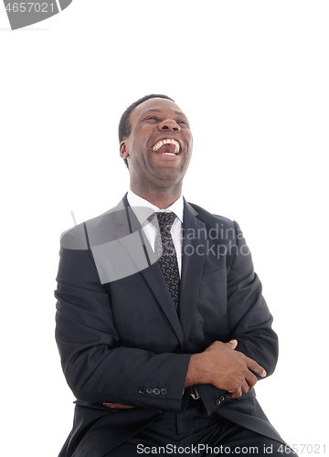 Image of A laughing African man with his head back