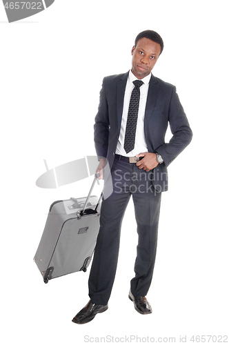 Image of Business man in suit with suitcase