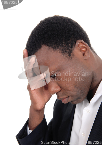 Image of Depressed African man with hand on face