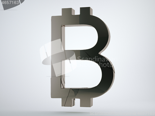 Image of Black bitcoin symbol with cracks on grey 