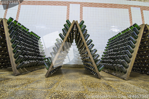 Image of White sparkling wine bottles storage