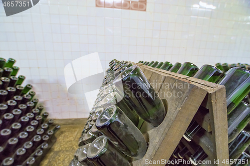 Image of Stands with white wine sparkling bottles