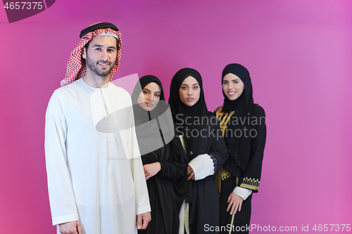 Image of portrait of young muslim people isolated on pink