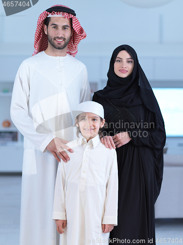 Image of portrait of young happy arabian muslim family