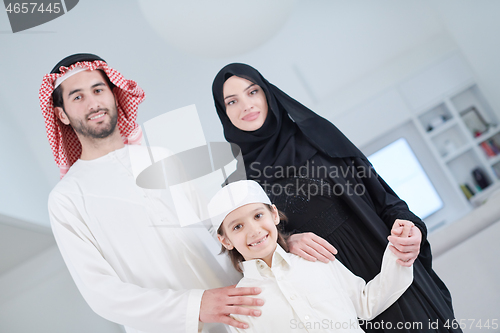 Image of portrait of young happy arabian muslim family