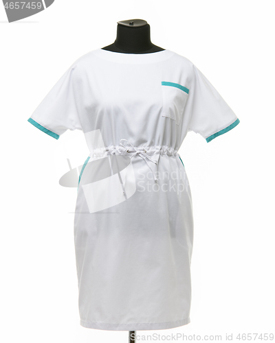 Image of Female medical gown on a mannequin for clothes on a white background, front view