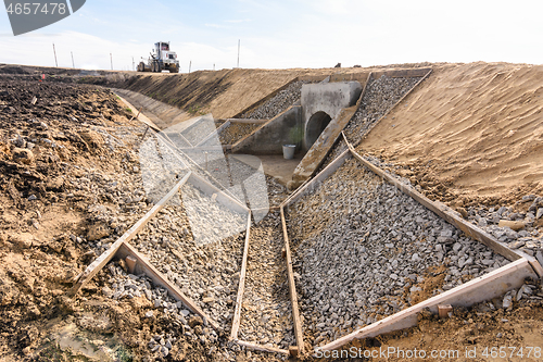 Image of Construction of a drainage ditch along a new road being built