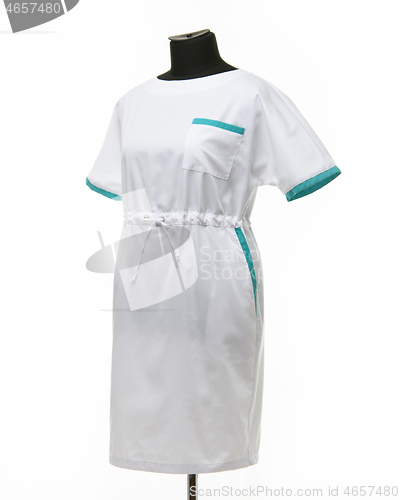 Image of Female medical gown on a mannequin for clothes on a white background