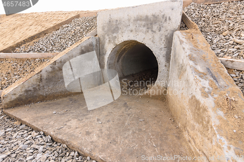 Image of Installation of culvert drainage pipe and ditch structures under the highway