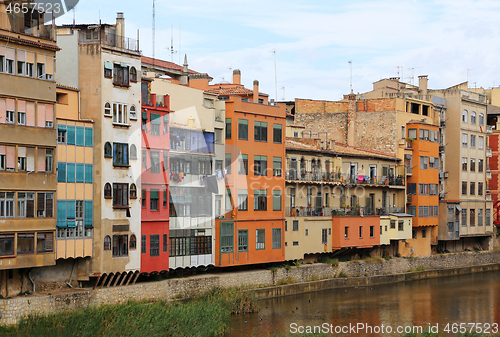 Image of Colorful ancient houses and river Onyar in Girona